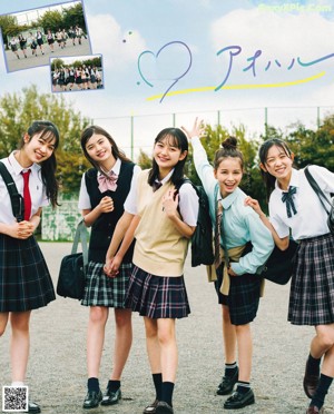 A group of young women laying on the ground together.